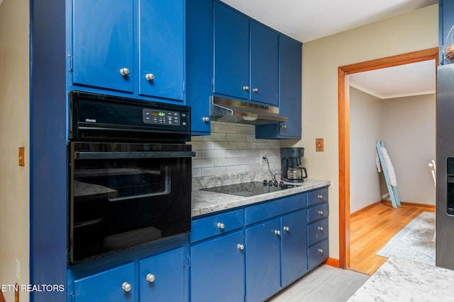 106 Morgan Rd, Oak Ridge, TN 37830 - kitchen with blue cabinetry, black appliances, under cabinet range hood, decorative backsplash, and ornamental molding