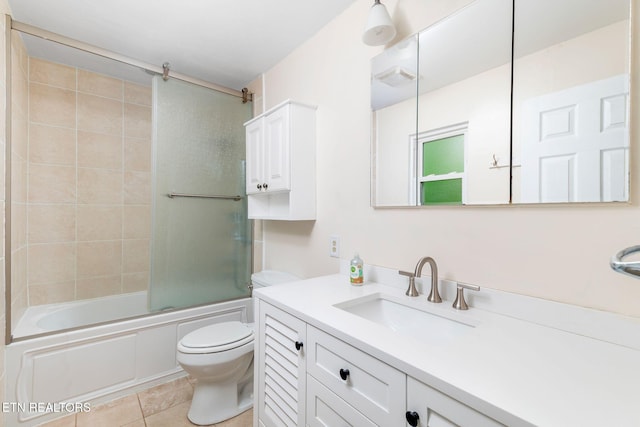 106 Morgan Rd, Oak Ridge, TN 37830 - full bathroom with toilet, vanity, shower / bath combination with glass door, and tile patterned floors