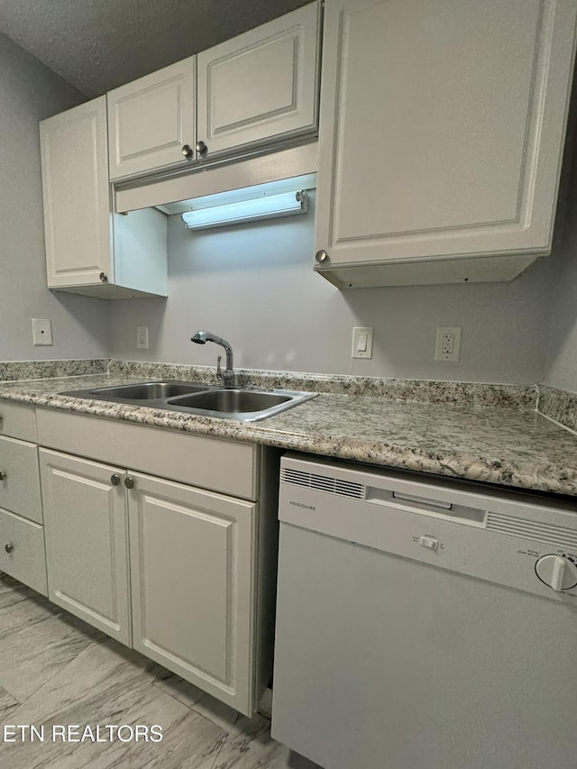 1304 Holyoke St, Kingsport, TN 37664 - kitchen with white dishwasher, a sink, white cabinetry, and light countertops