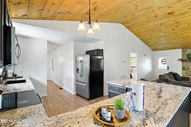 3050 Patty View Way, Sevierville, TN 37862 - kitchen with appliances with stainless steel finishes, vaulted ceiling, wooden ceiling, light wood-style flooring, and a sink