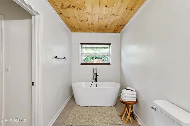 3050 Patty View Way, Sevierville, TN 37862 - bathroom featuring wooden ceiling, a freestanding bath, baseboards, tile patterned flooring, and toilet