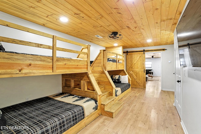 3050 Patty View Way, Sevierville, TN 37862 - bedroom with a barn door, wooden ceiling, light wood-type flooring, and recessed lighting