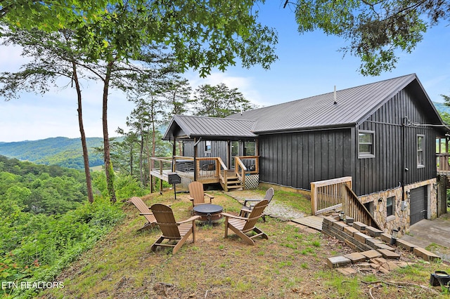 3050 Patty View Way, Sevierville, TN 37862 - view of yard featuring a fire pit, a deck with mountain view, and an attached garage