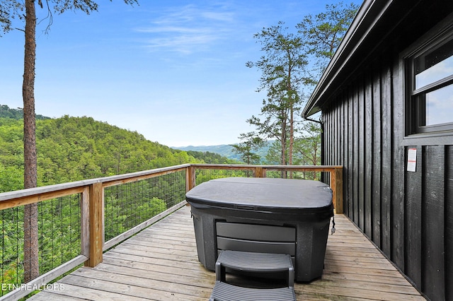 3050 Patty View Way, Sevierville, TN 37862 - wooden deck with a hot tub, a view of trees, and a mountain view
