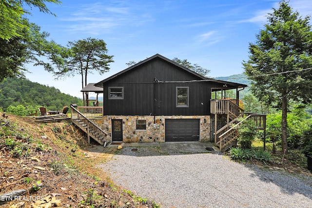 3050 Patty View Way, Sevierville, TN 37862 - view of property exterior featuring stairway, stone siding, and gravel driveway