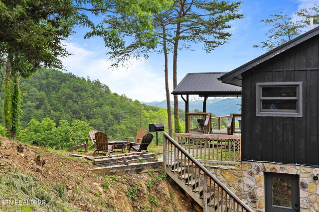 3050 Patty View Way, Sevierville, TN 37862 - view of yard with an outdoor fire pit, a wooden deck, stairs, and a forest view