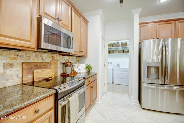 192 Saloli Way, Loudon, TN 37774 - kitchen with stainless steel appliances, washer and dryer, light stone countertops, ornamental molding, and decorative backsplash