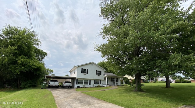 106 Apache Rd, Maryville, TN 37804 - split level home featuring an attached carport, a front yard, and concrete driveway