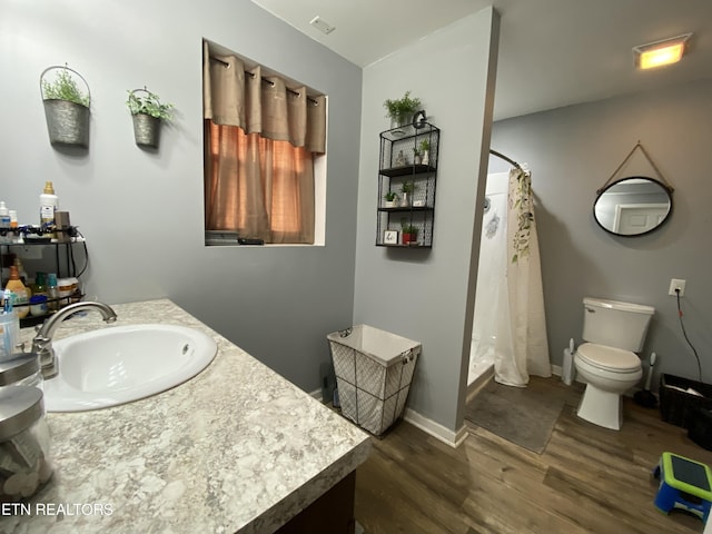 106 Apache Rd, Maryville, TN 37804 - full bath featuring wood finished floors, vanity, toilet, a stall shower, and baseboards