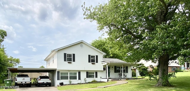 106 Apache Rd, Maryville, TN 37804 - split level home featuring a carport, a front lawn, covered porch, and concrete driveway
