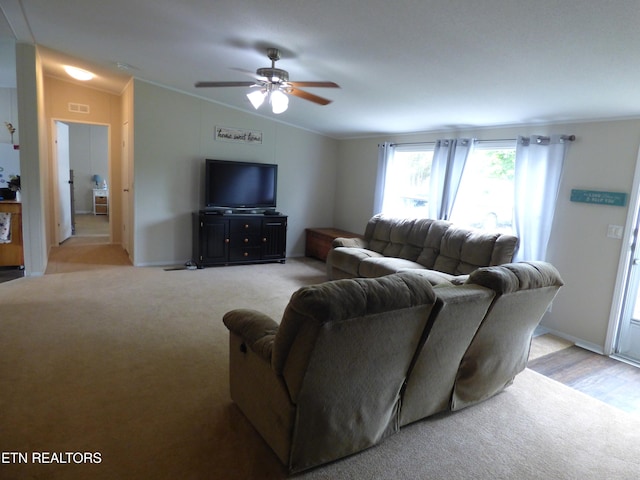 395 E Dumplin Valley Rd, Jefferson City, TN 37760 - living room featuring vaulted ceiling, light colored carpet, a ceiling fan, and ornamental molding