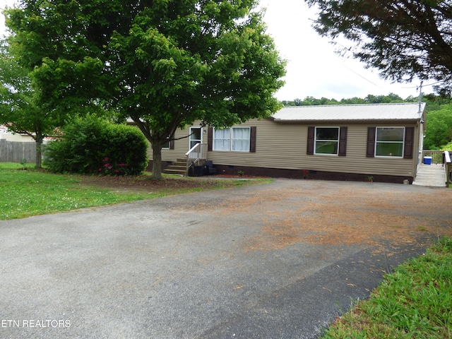 395 E Dumplin Valley Rd, Jefferson City, TN 37760 - view of front of property with crawl space, driveway, metal roof, and entry steps