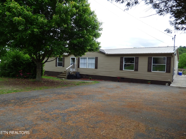 395 E Dumplin Valley Rd, Jefferson City, TN 37760 - manufactured / mobile home featuring crawl space, metal roof, and asphalt driveway