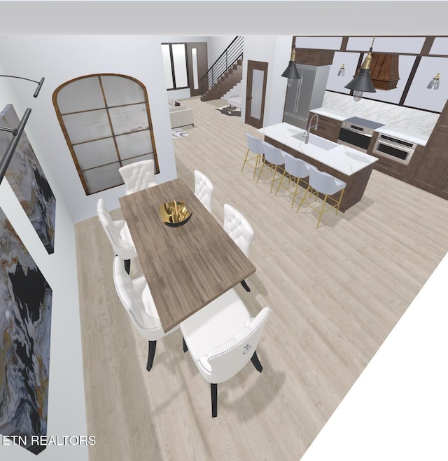 234 Caton Rd Unit 8, Sevierville, TN 37862 - dining area with light wood finished floors and stairway