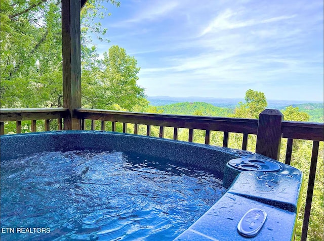 2438 Walnut Ridge Way, Sevierville, TN 37862 - wooden terrace featuring a jacuzzi