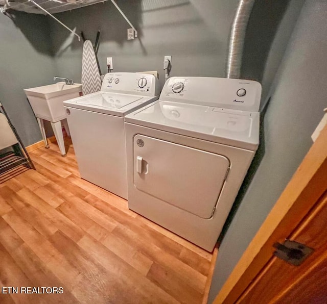 2438 Walnut Ridge Way, Sevierville, TN 37862 - laundry area with independent washer and dryer and light wood-style floors