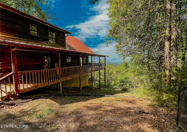 2438 Walnut Ridge Way, Sevierville, TN 37862 - rear view of house featuring a wooden deck and metal roof