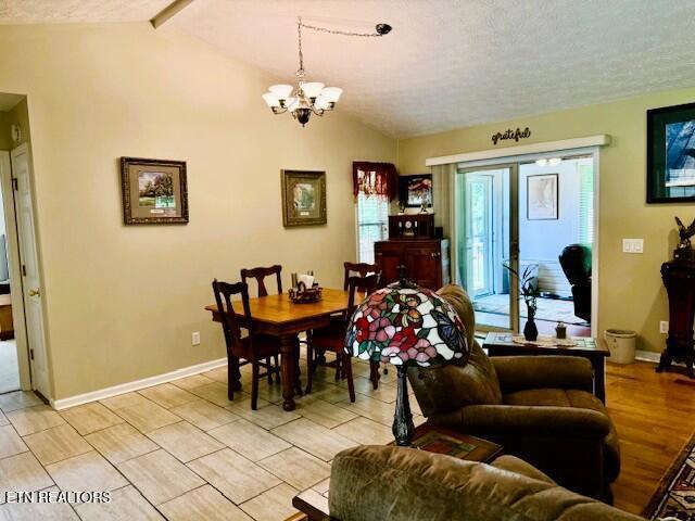 15 Felix Ct, Crossville, TN 38558 - dining space featuring a chandelier, baseboards, and a textured ceiling