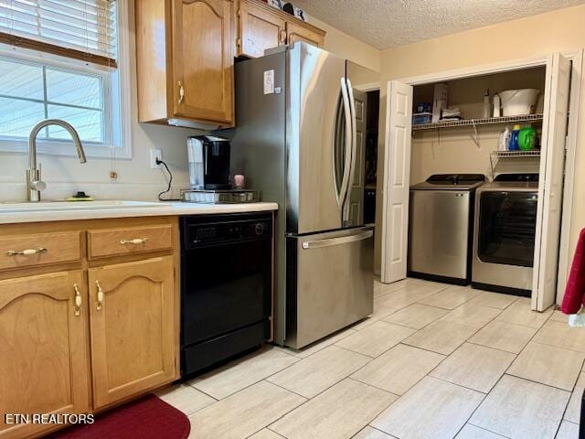 15 Felix Ct, Crossville, TN 38558 - kitchen with black dishwasher, a sink, washing machine and clothes dryer, light countertops, and a textured ceiling