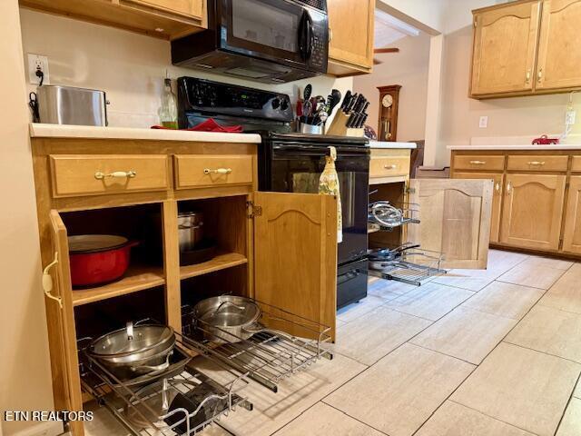 15 Felix Ct, Crossville, TN 38558 - kitchen with black appliances, light countertops, and light tile patterned floors