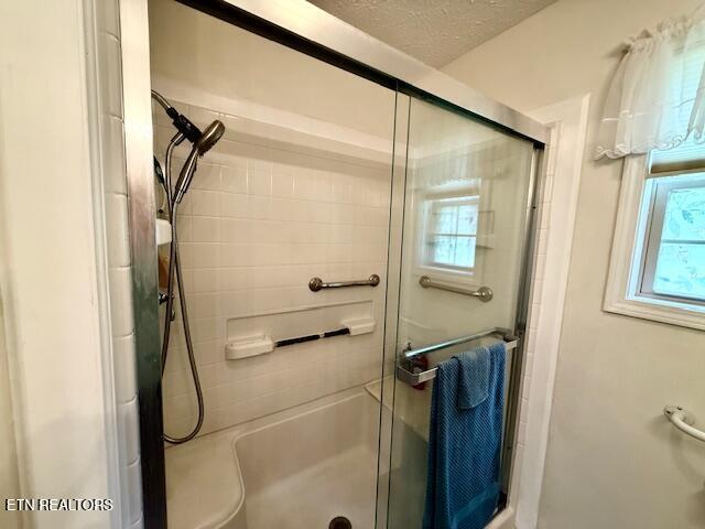 15 Felix Ct, Crossville, TN 38558 - bathroom with a shower stall and a textured ceiling