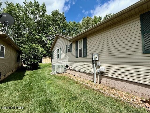 15 Felix Ct, Crossville, TN 38558 - view of property exterior with central air condition unit and a lawn