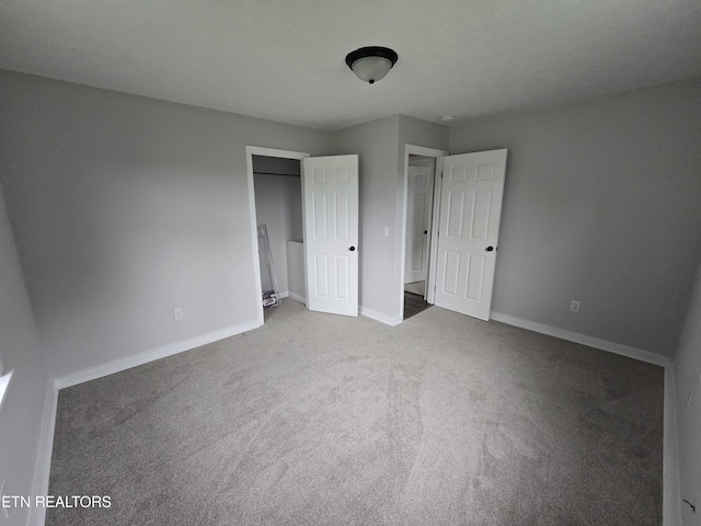 550 N 13th St, Lafollette, TN 37766 - unfurnished bedroom featuring carpet, baseboards, and a closet