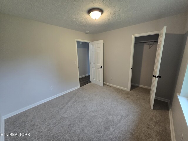 550 N 13th St, Lafollette, TN 37766 - unfurnished bedroom with carpet flooring, a textured ceiling, a closet, and baseboards