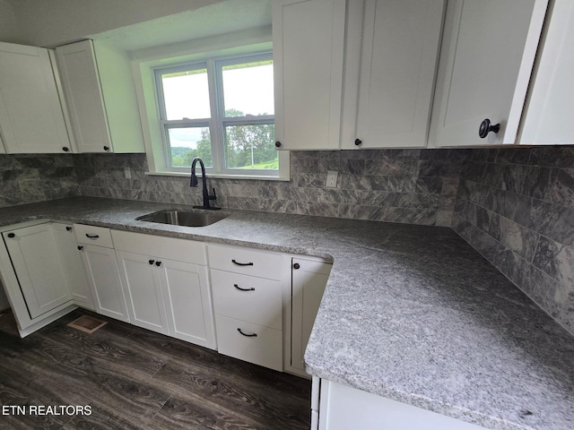 550 N 13th St, Lafollette, TN 37766 - kitchen with a sink, white cabinets, decorative backsplash, and dark wood-type flooring