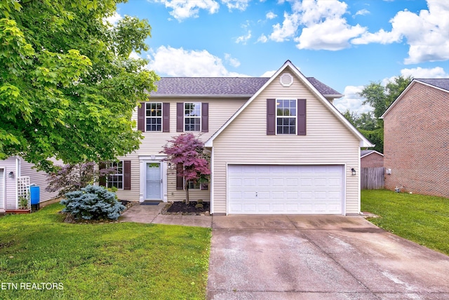2040 Cartmill Dr, Powell, TN 37849 - traditional-style house featuring driveway, a garage, a front lawn, and a shingled roof