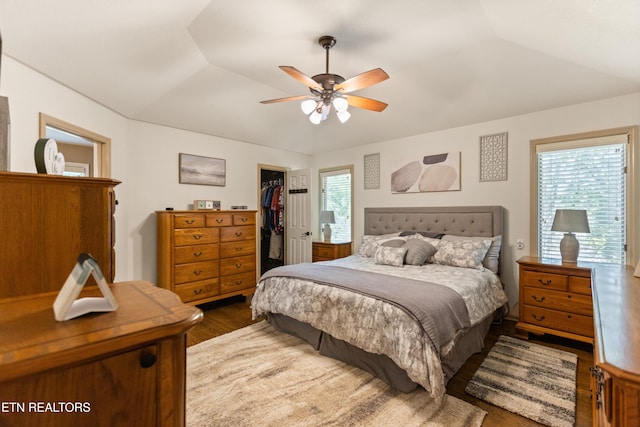 407 Tecumseh Pt, Loudon, TN 37774 - bedroom with wood finished floors, a spacious closet, lofted ceiling, a closet, and ceiling fan