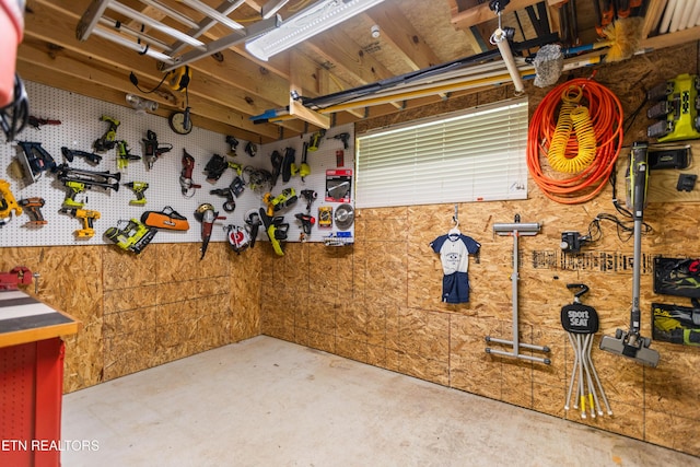 407 Tecumseh Pt, Loudon, TN 37774 - miscellaneous room featuring unfinished concrete flooring and a workshop area