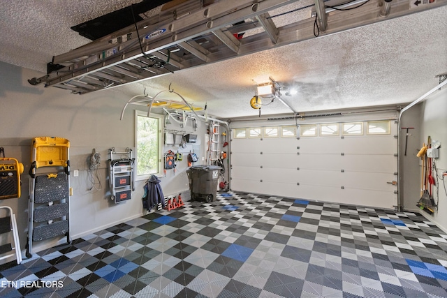 407 Tecumseh Pt, Loudon, TN 37774 - garage featuring a garage door opener
