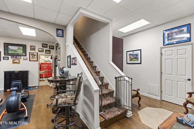 407 Tecumseh Pt, Loudon, TN 37774 - stairway with a paneled ceiling, arched walkways, wood finished floors, and baseboards