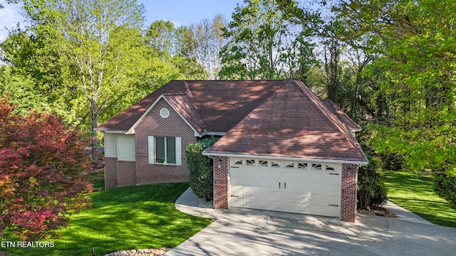 407 Tecumseh Pt, Loudon, TN 37774 - view of front of home with brick siding, a front yard, and driveway