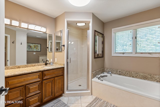 407 Tecumseh Pt, Loudon, TN 37774 - full bath featuring vanity, a shower stall, a bath, and tile patterned floors