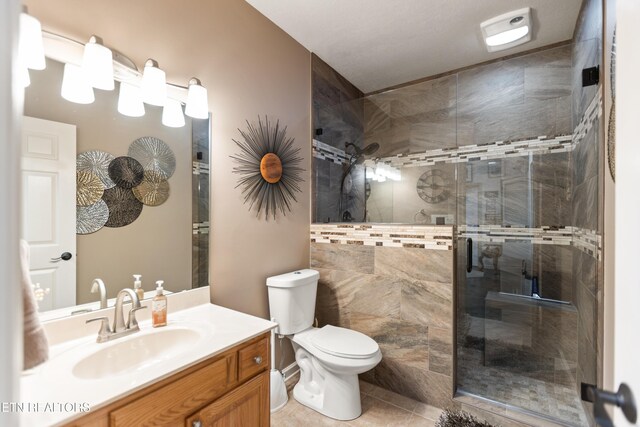 407 Tecumseh Pt, Loudon, TN 37774 - full bath featuring vanity, a stall shower, toilet, and tile patterned floors