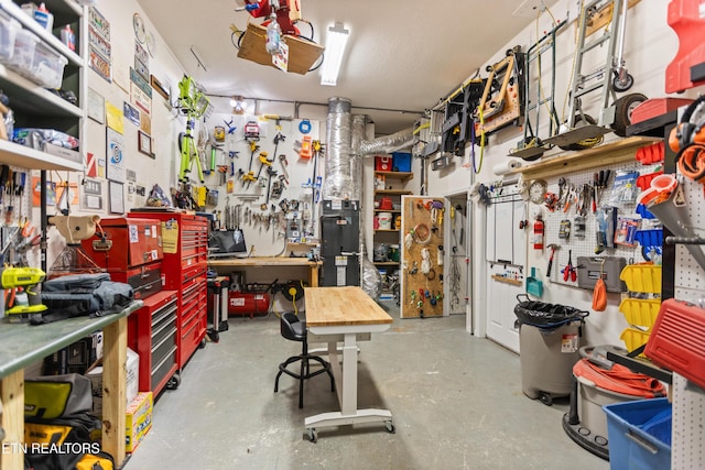 407 Tecumseh Pt, Loudon, TN 37774 - miscellaneous room with a workshop area and concrete flooring