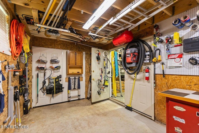 407 Tecumseh Pt, Loudon, TN 37774 - misc room featuring a workshop area and unfinished concrete flooring