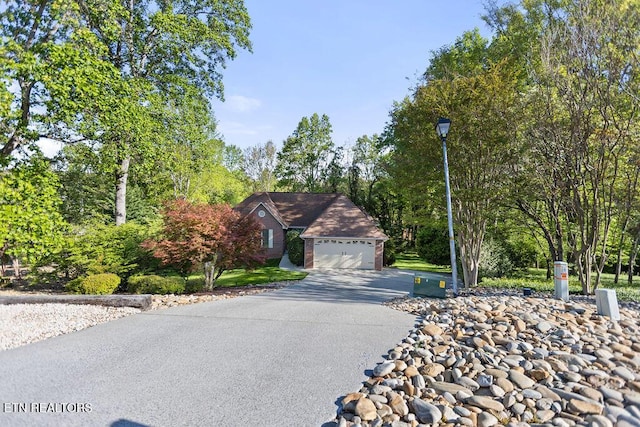 407 Tecumseh Pt, Loudon, TN 37774 - view of front facade with asphalt driveway and an attached garage