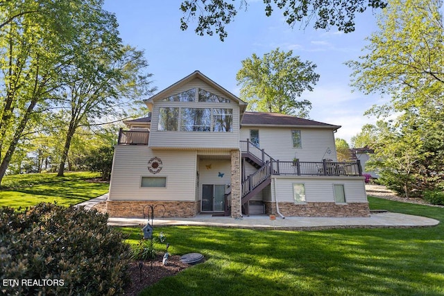 407 Tecumseh Pt, Loudon, TN 37774 - rear view of property featuring stone siding, a yard, stairway, and a patio area