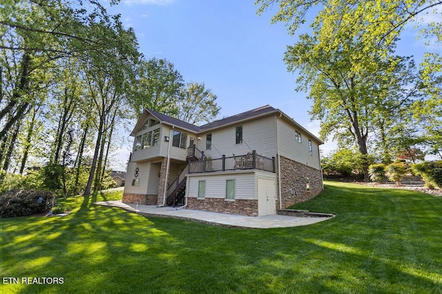 407 Tecumseh Pt, Loudon, TN 37774 - rear view of property featuring stone siding, stairway, a patio, a lawn, and a wooden deck