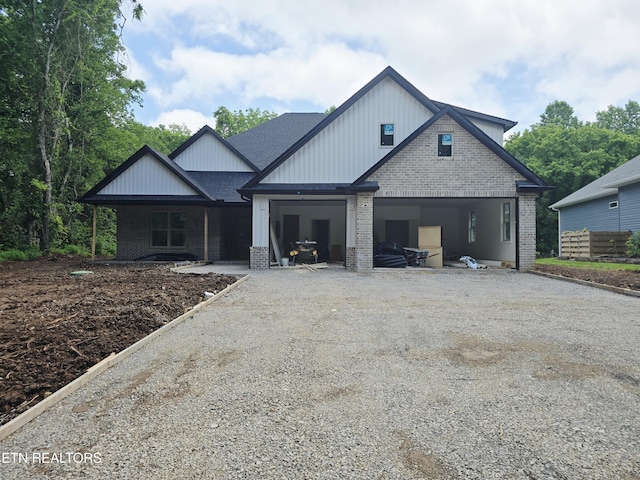123 Dudala Way, Loudon, TN 37774 - view of front of house featuring brick siding, driveway, an attached garage, and a shingled roof