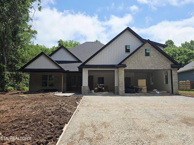 123 Dudala Way, Loudon, TN 37774 - view of front of home featuring brick siding, french doors, roof with shingles, and driveway