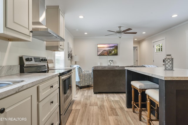 743 Pollard Rd, Kodak, TN 37764 - kitchen featuring stainless steel electric range, wall chimney range hood, healthy amount of natural light, crown molding, and light countertops