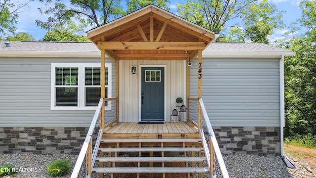 743 Pollard Rd, Kodak, TN 37764 - property entrance with roof with shingles and stone siding