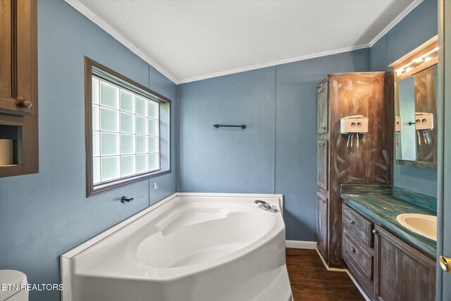 938 Riley Creek Rd, Whitleyville, TN 38588 - bathroom with ornamental molding, vanity, a bath, wood finished floors, and toilet