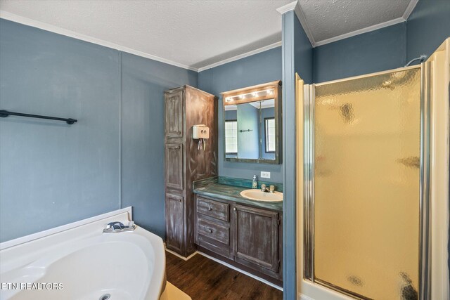 938 Riley Creek Rd, Whitleyville, TN 38588 - full bath featuring a stall shower, vanity, wood finished floors, a garden tub, and crown molding
