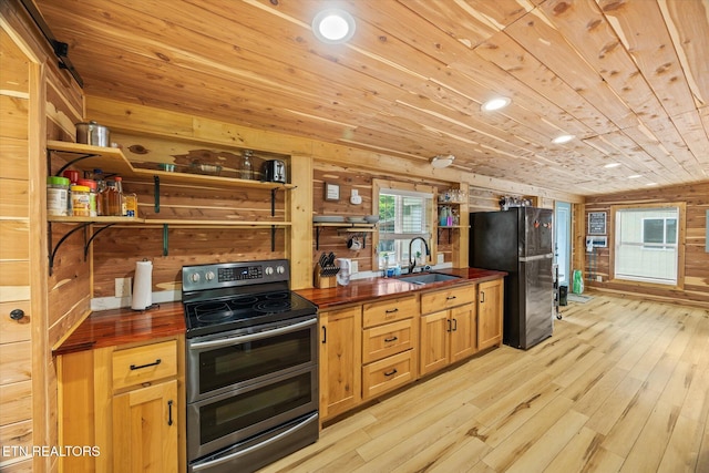 938 Riley Creek Rd, Whitleyville, TN 38588 - kitchen featuring double oven range, a sink, butcher block counters, freestanding refrigerator, and open shelves