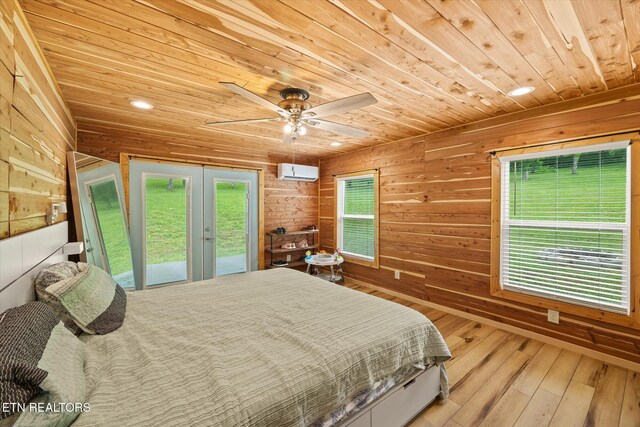 938 Riley Creek Rd, Whitleyville, TN 38588 - bedroom with wood ceiling, access to outside, a wall mounted AC, french doors, and wood walls